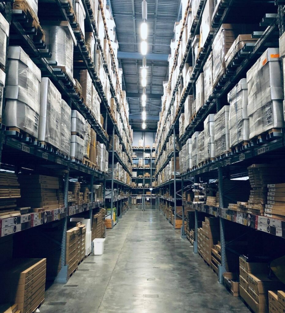 Interior of a modern high-bay distribution warehouse with racked pallets